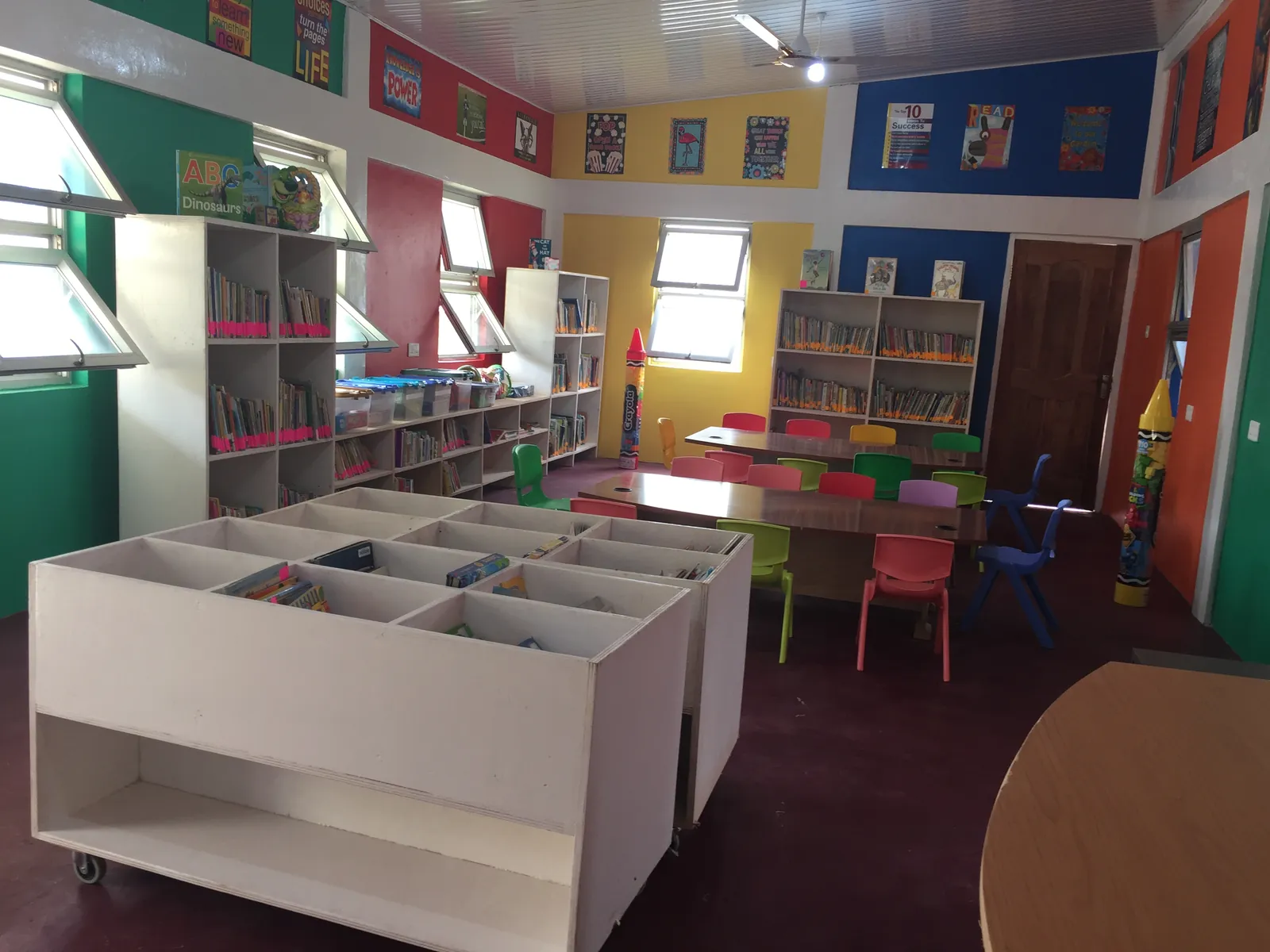 Inside the library: book bins, shelves and child-size tables