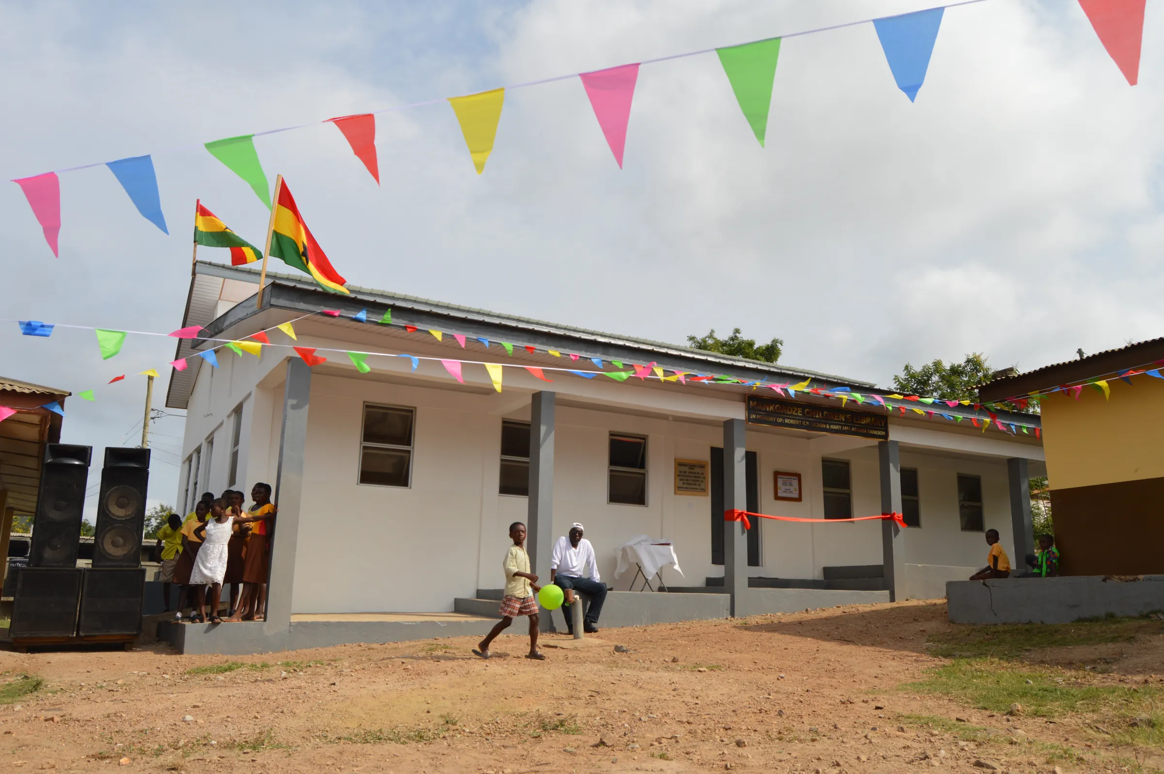 The Mankoadze Children's Library building decorated with flags and bunting