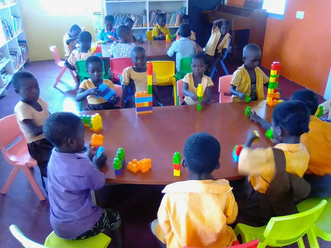 Young children playing with building blocks at the library